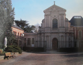 modern color photo of street entrance to Carmelite chapel in Lisieux