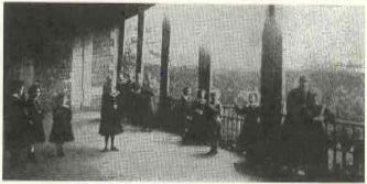 Pupils of the Benedictine Abbey at recreation on the terrace, looking out over the city of Lisieux