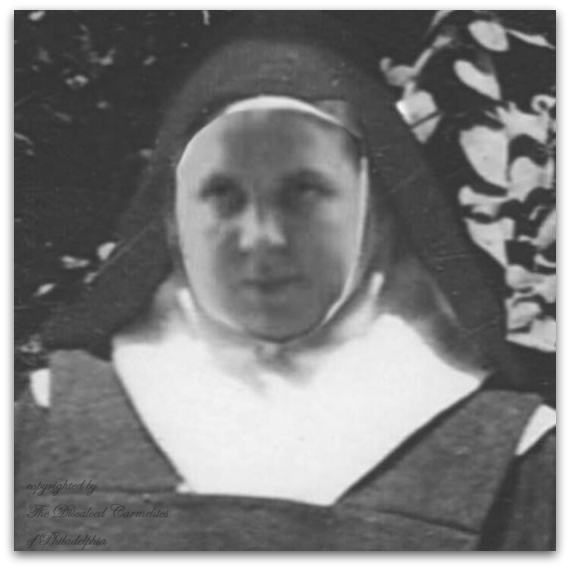 black and white headshot of Sister Mary in Carmelite habit and veil, a broad face